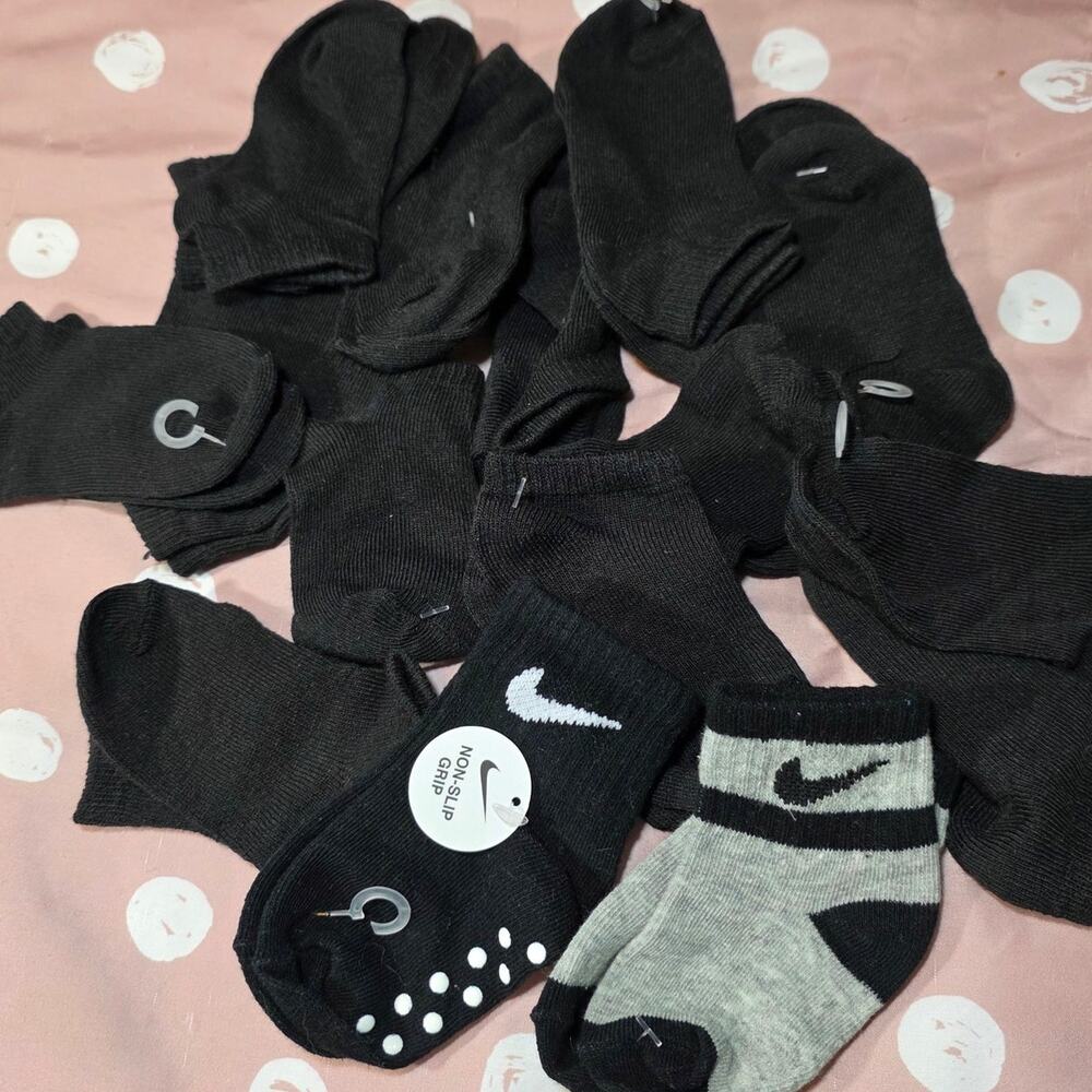 Infant pile of 15 pairs of socks NEW black gray white nike non skid bottoms some